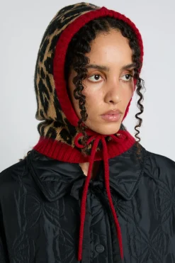 hood in leopard with red tie