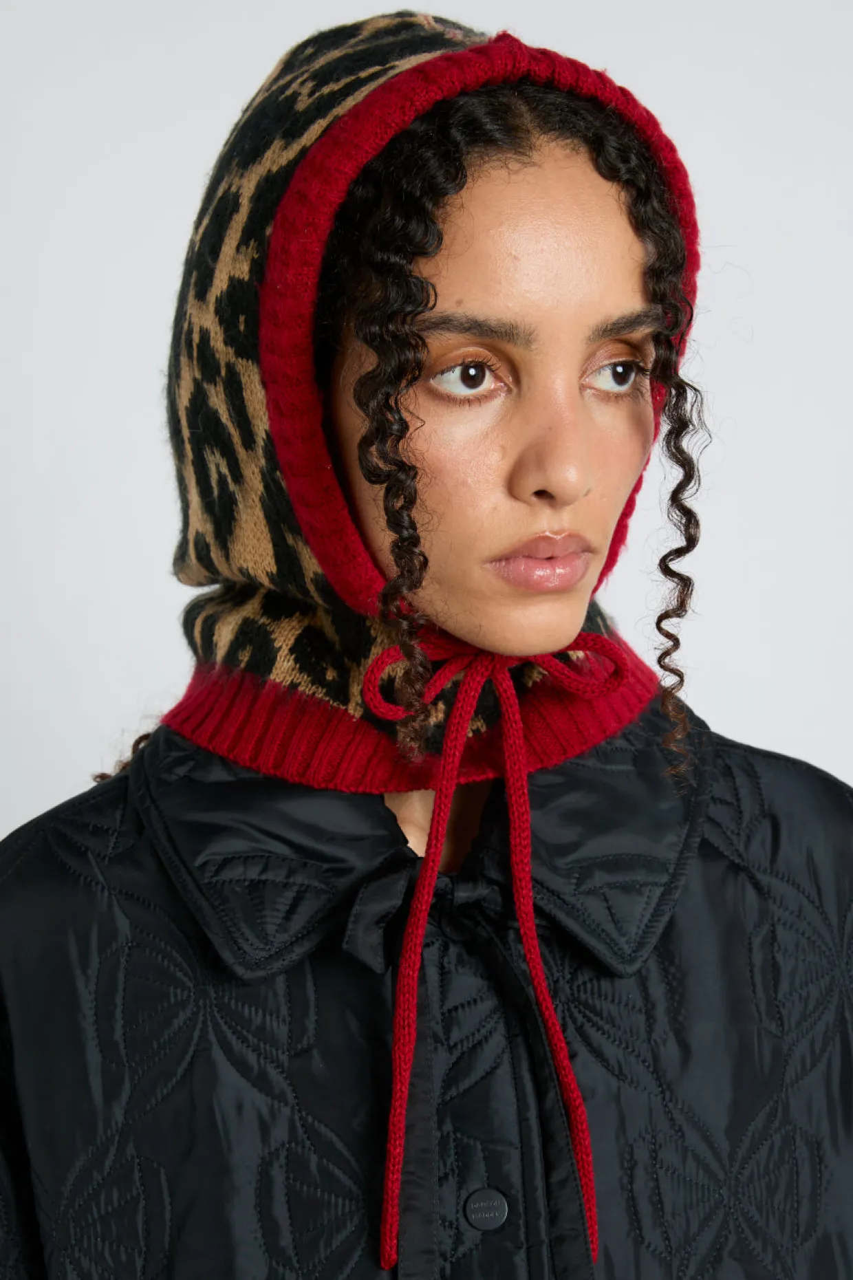 hood in leopard with red tie